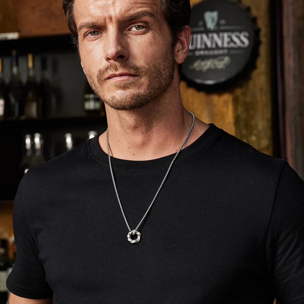 Mobius pendant necklace worn at shorter chest length