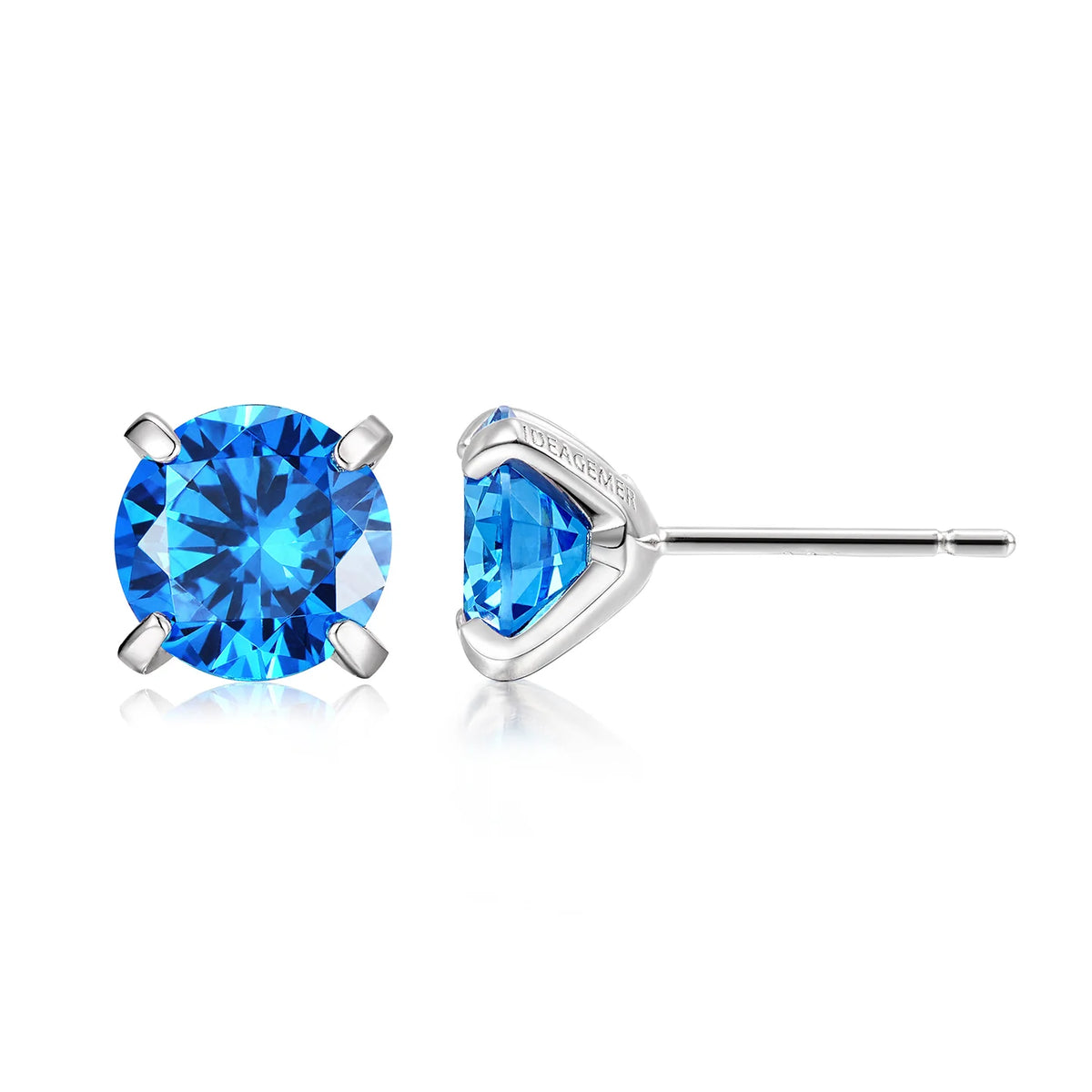 Blue cubic zirconia stud earrings worn close up