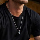 Spear pendant necklace worn at long chest length