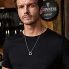 Mobius pendant necklace worn at shorter chest length