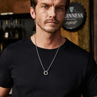 Mobius pendant necklace worn at longer chest length