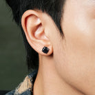 Black cubic zirconia silver stud earrings angled pair
