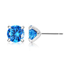 Blue cubic zirconia stud earrings worn close up