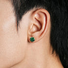 Green stone sterling silver studs worn profile view